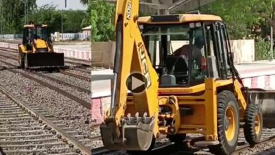 JCB on train tracks